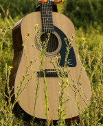 Guitar, resting in a field. Guitar, resting in a field.